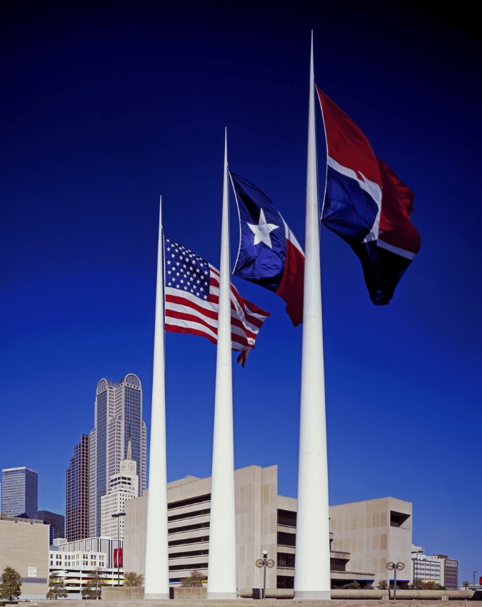 Dallas TX Technology Staffing Firm - Picture of US flag, Texas state flag, and Dallas city flag in downtown Dallas